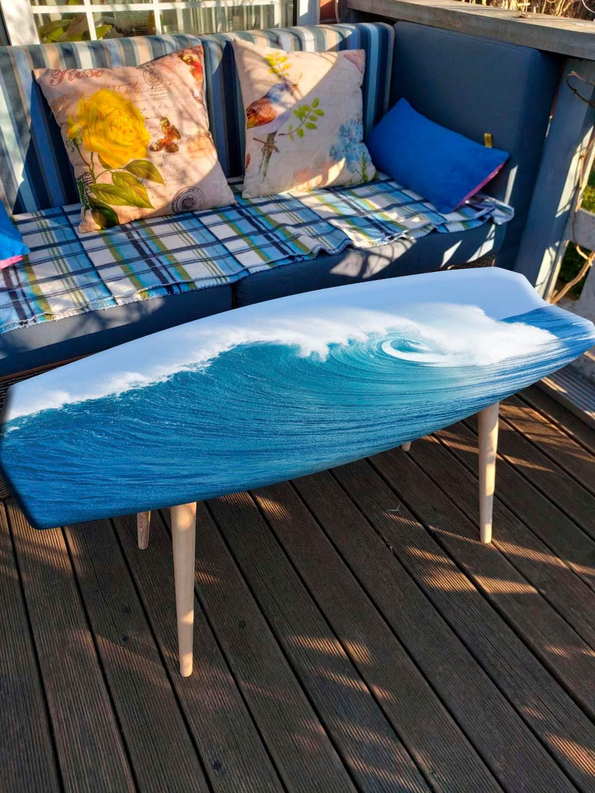 Surfboard coffee table with ocean wave