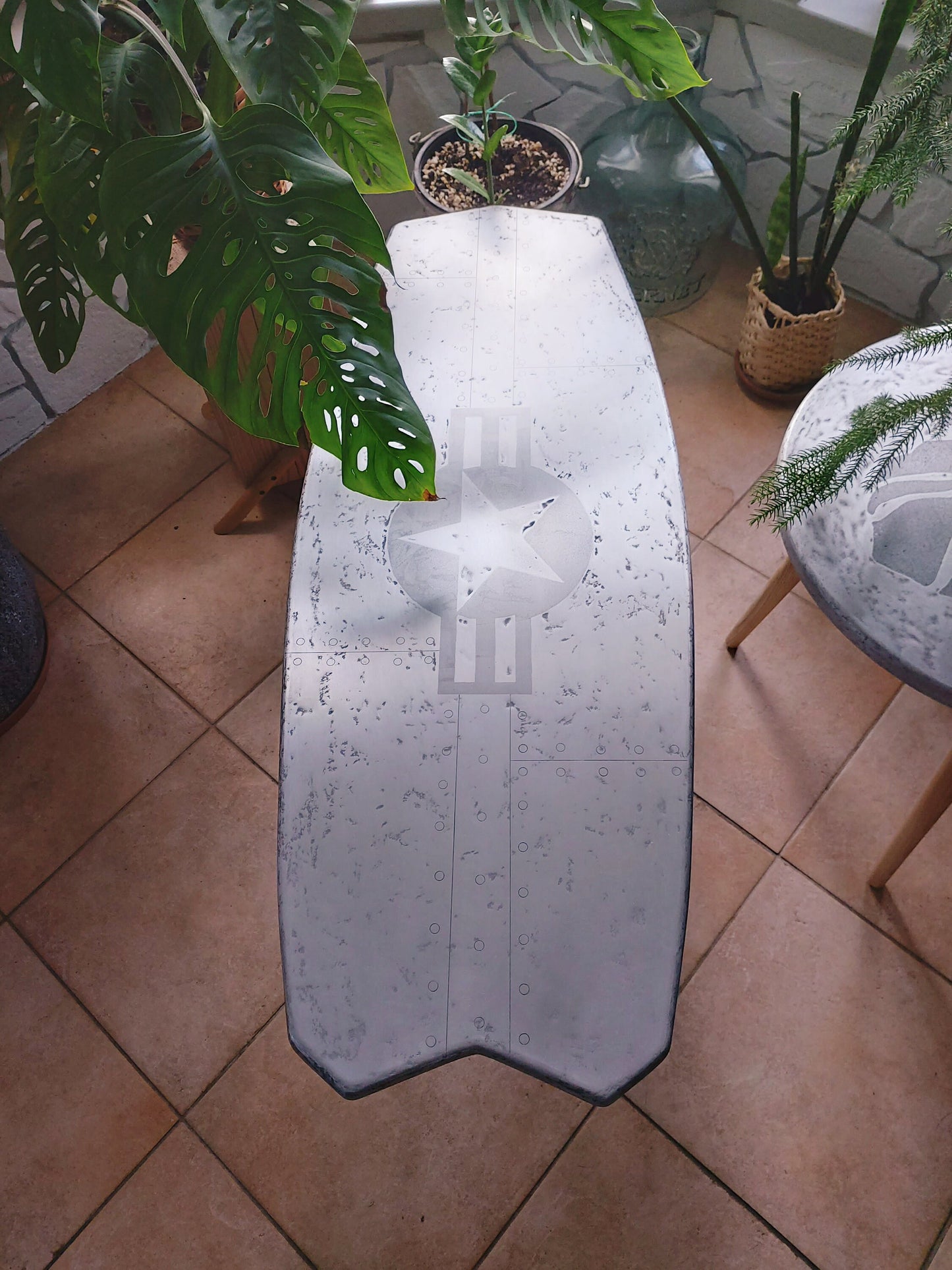 Steampunk-Inspired Kiteboard Table with Star and Rivets Pattern