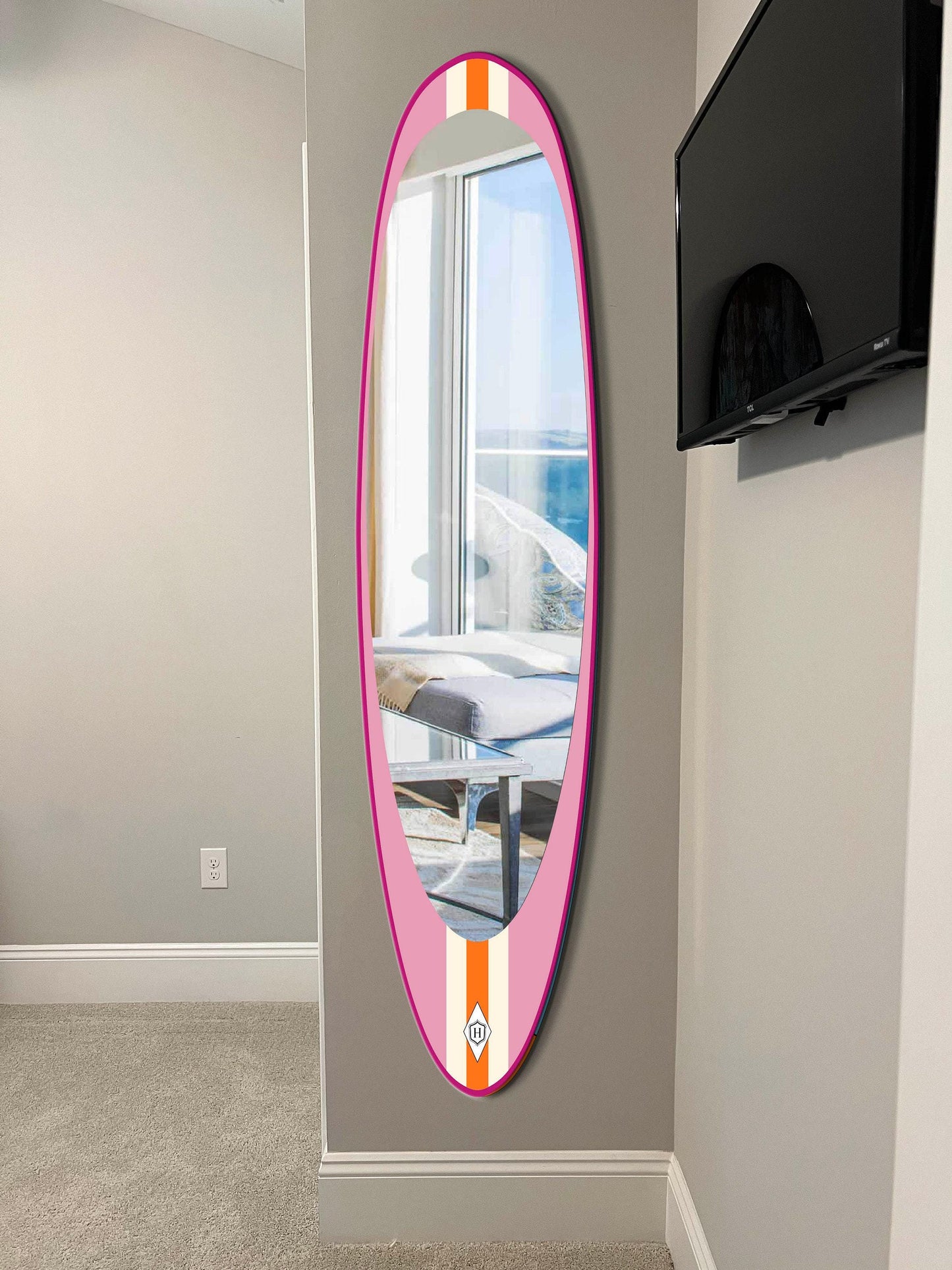 Wall mirror in surfboard shaped frame