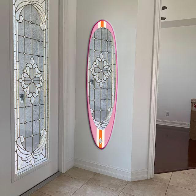 Wall mirror in surfboard shaped frame