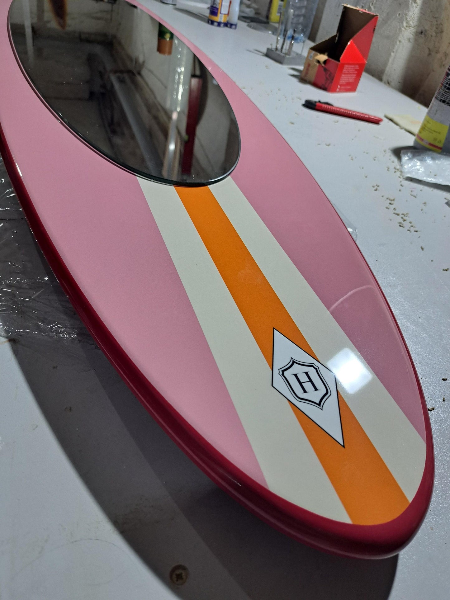 Wall mirror in surfboard shaped frame