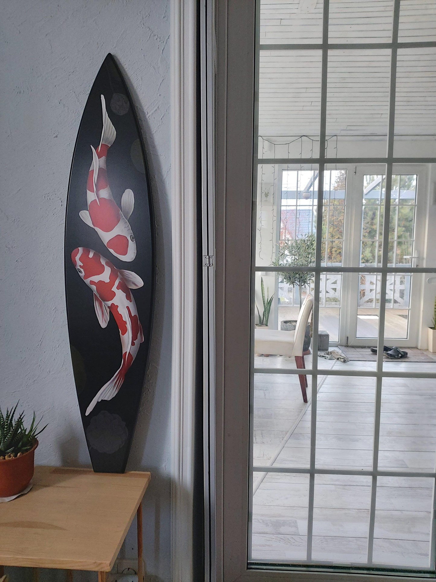 Surfboard wall art with mermaid
