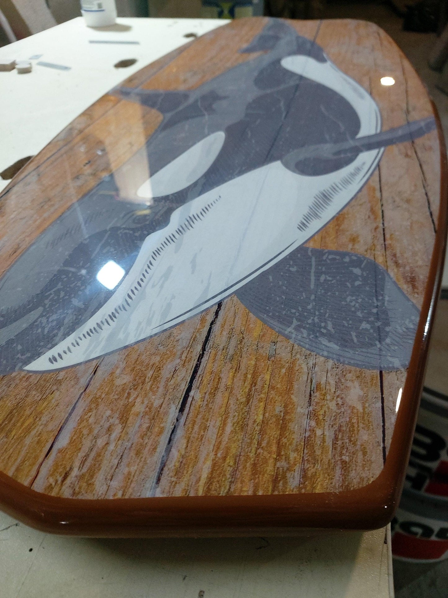 Surfboard coffee table with orca , killer whale