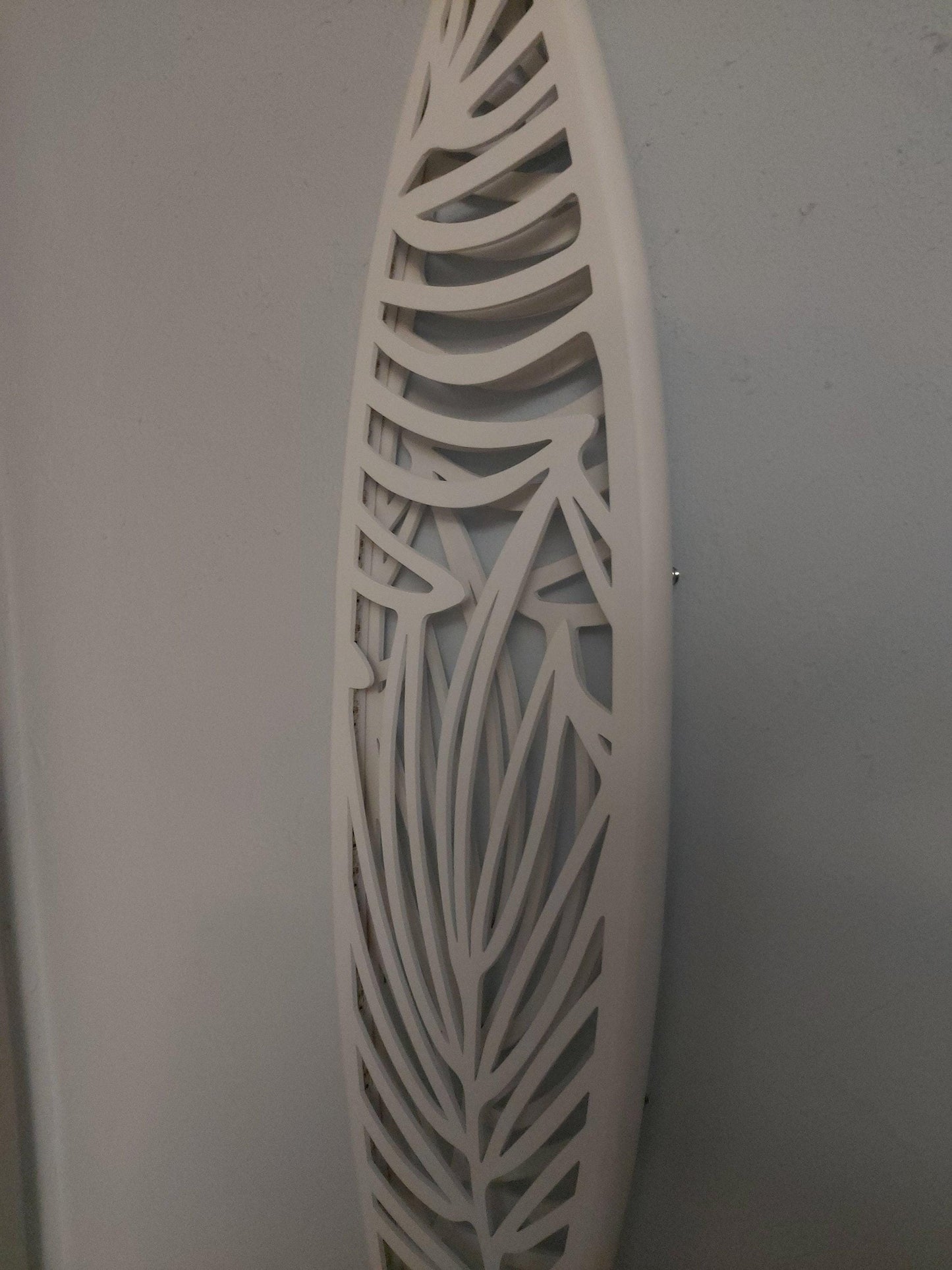 Surfboard inspired wall led light with botanical pattern