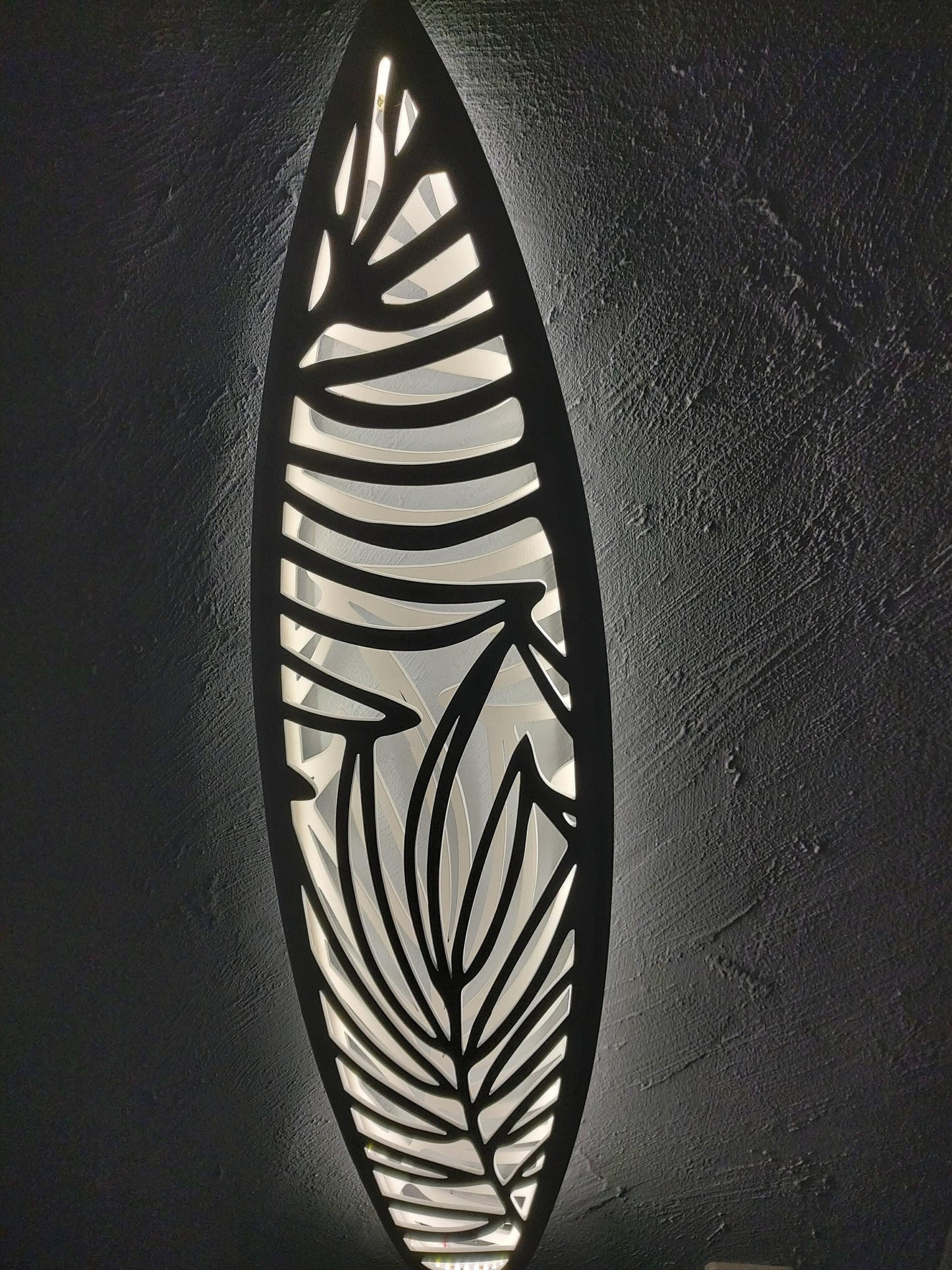 Surfboard inspired wall led light with botanical pattern
