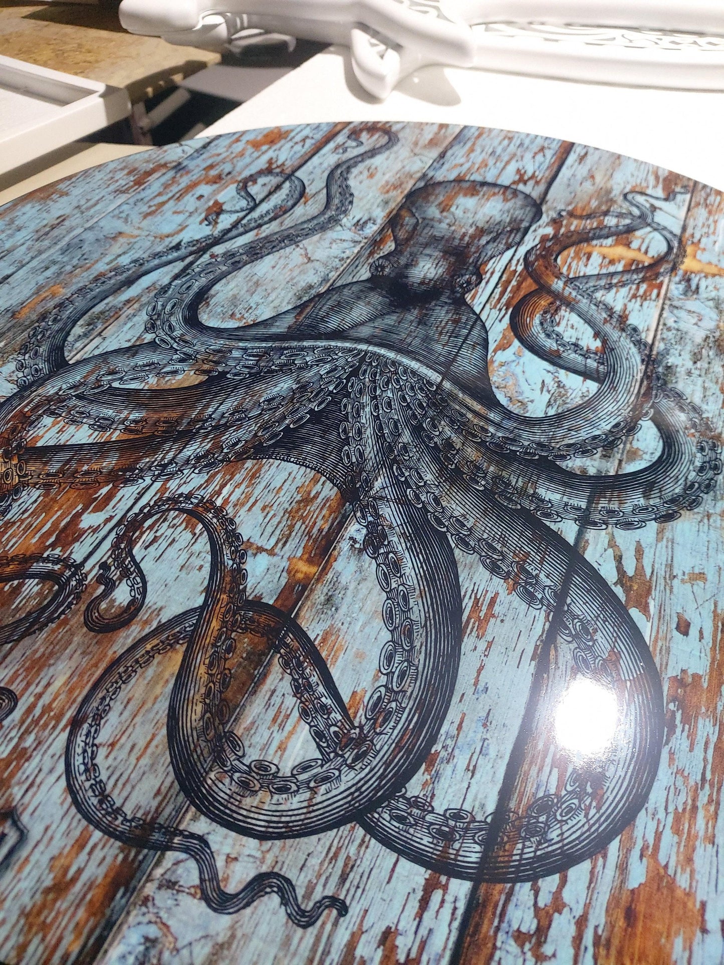 Round vintage coffee table with octopus.