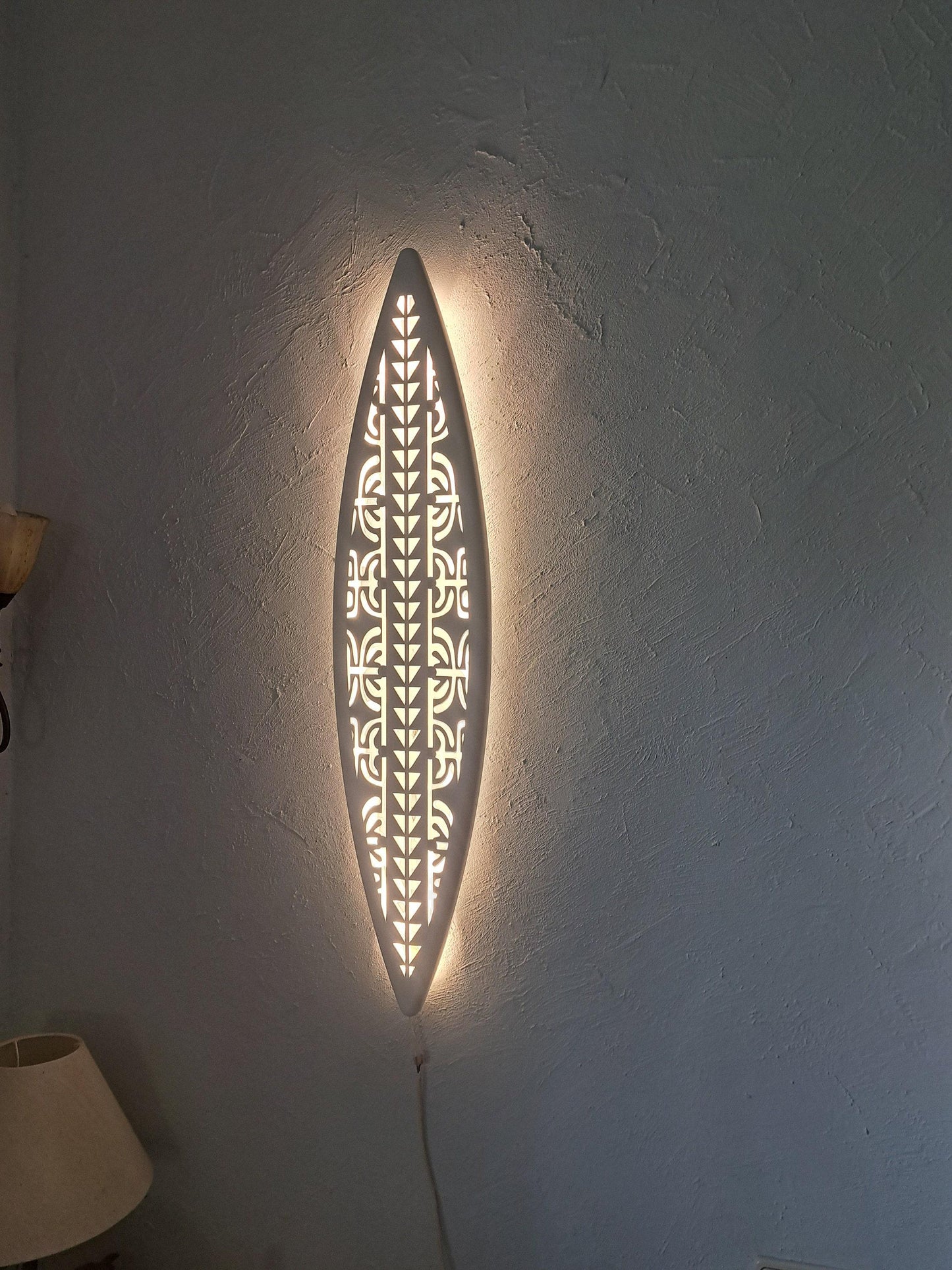 Surfboard inspired wall led light with maori pattern