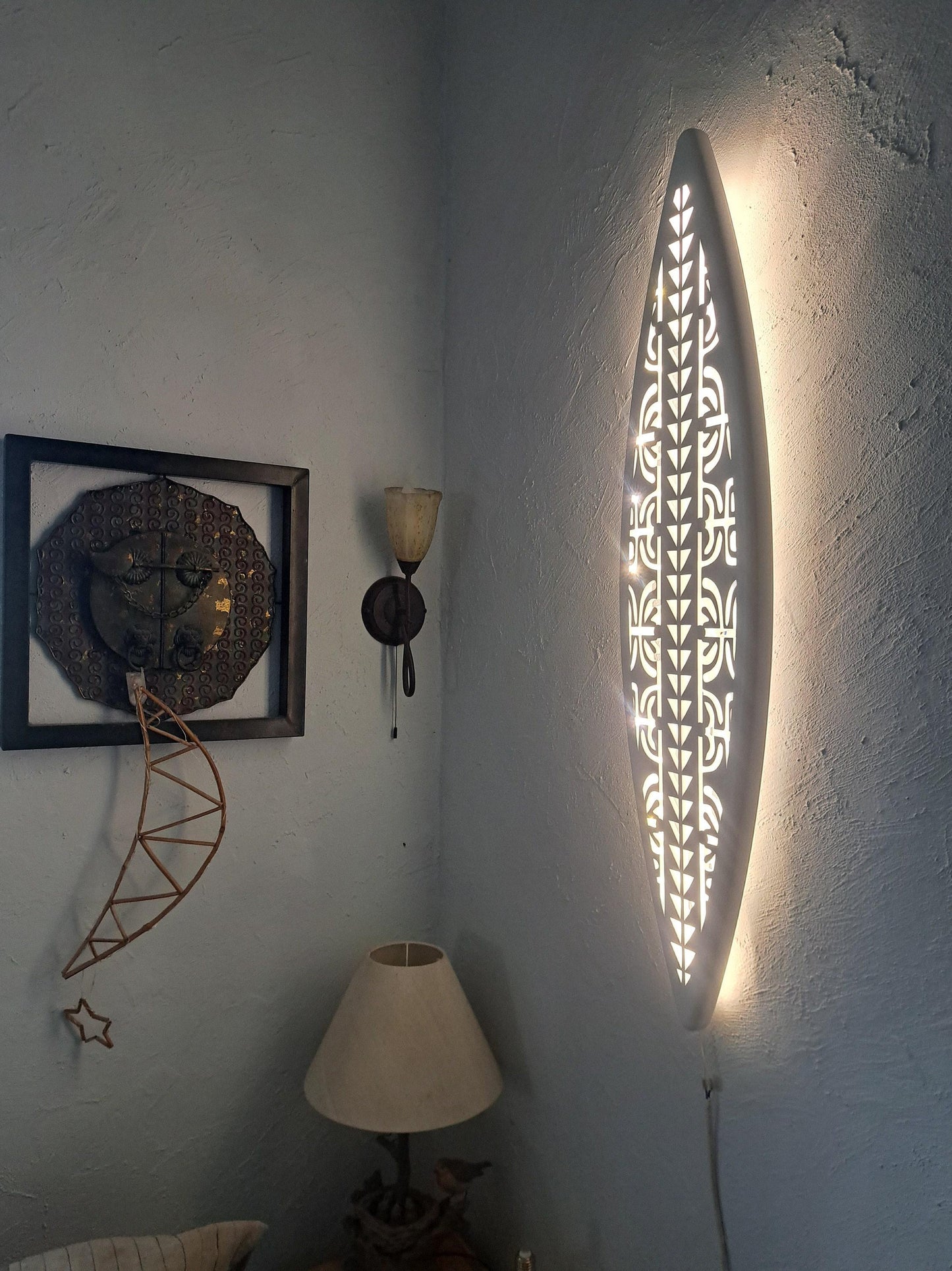 Surfboard inspired wall led light with maori pattern