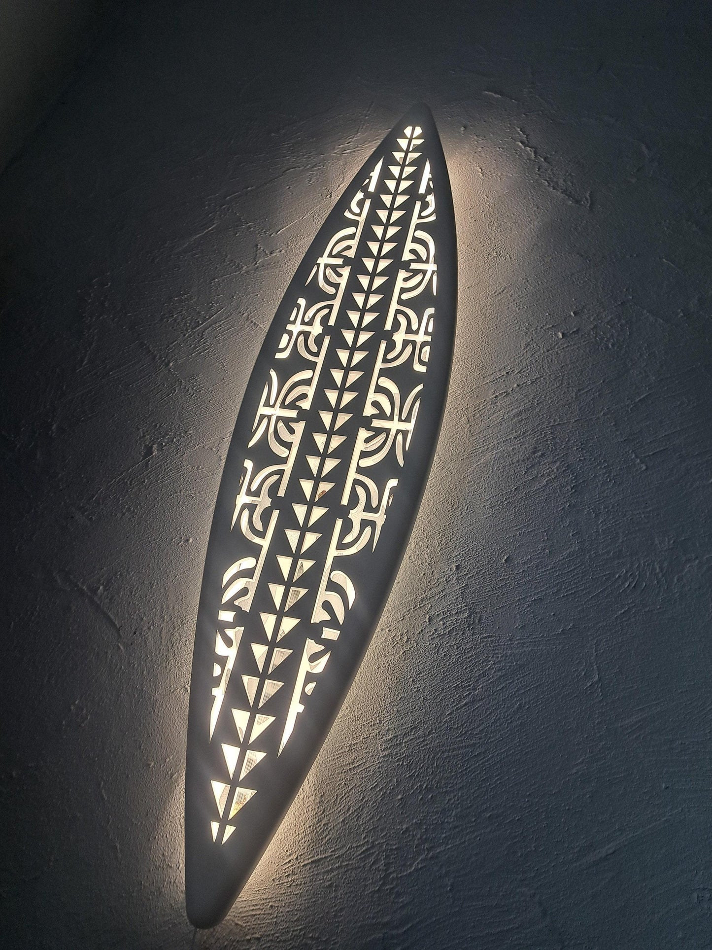 Surfboard inspired wall led light with maori pattern