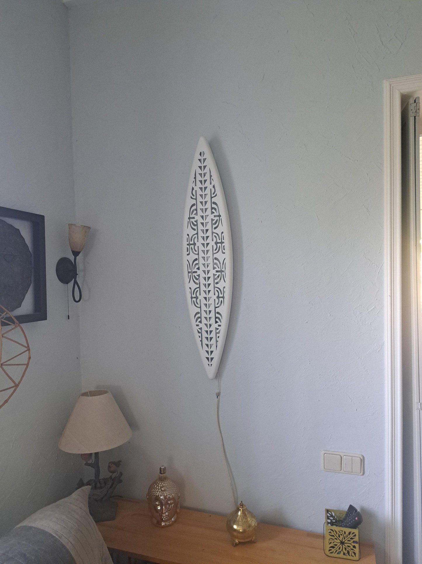 Surfboard inspired wall led light with maori pattern