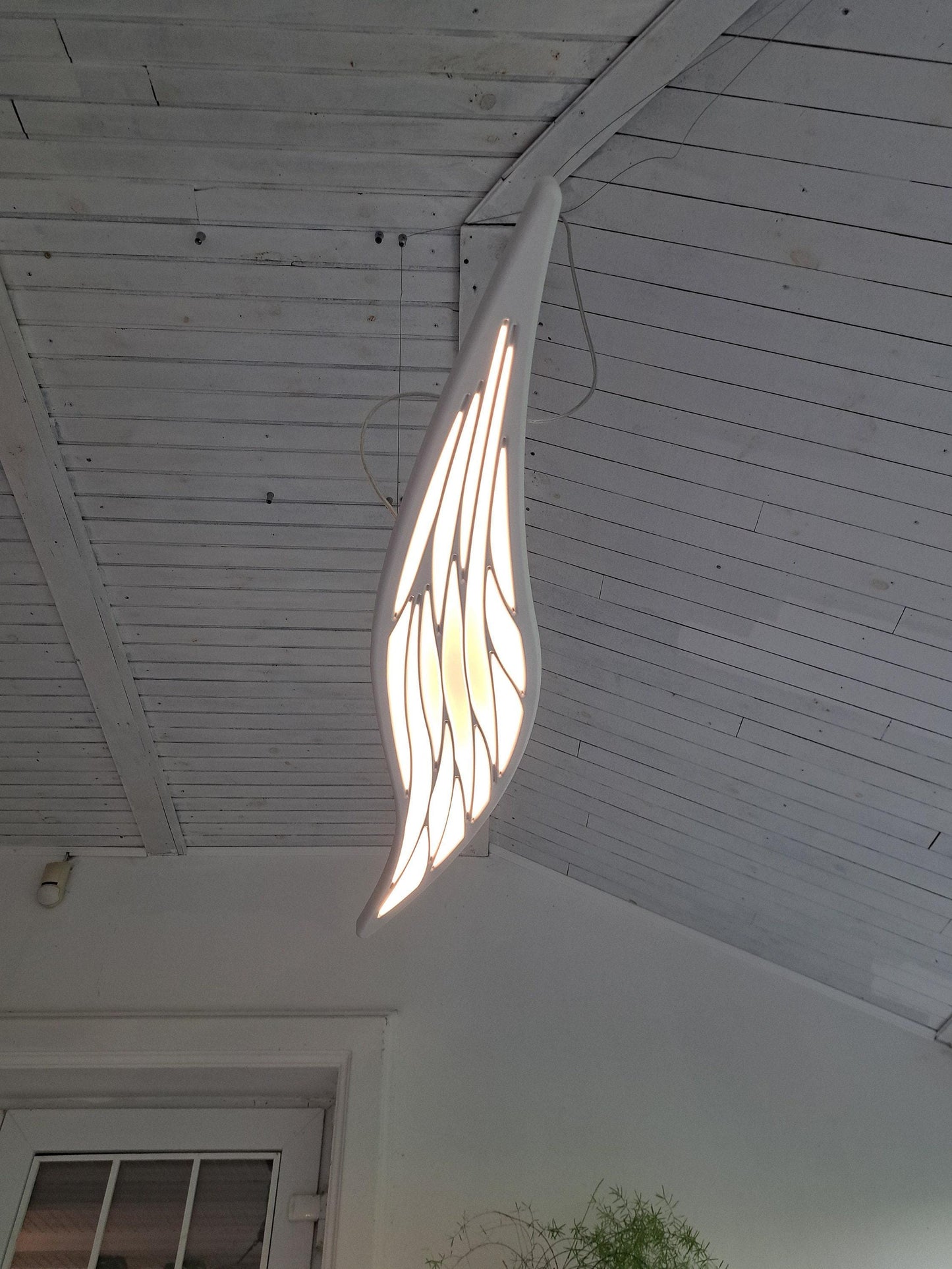 Surfboard inspired wall led light with maori pattern
