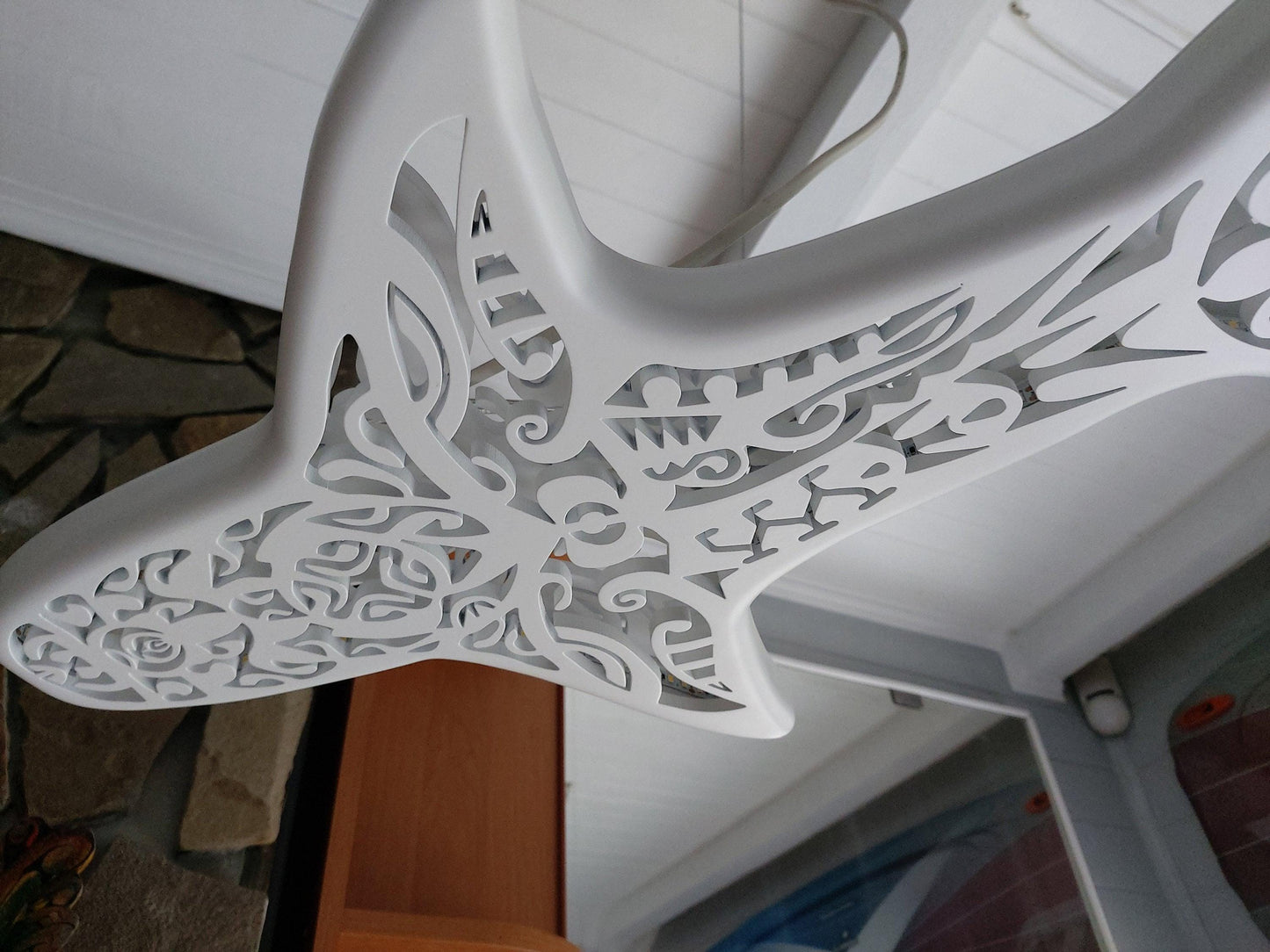 Shark-shaped ceiling chandelier in Maori surf style
