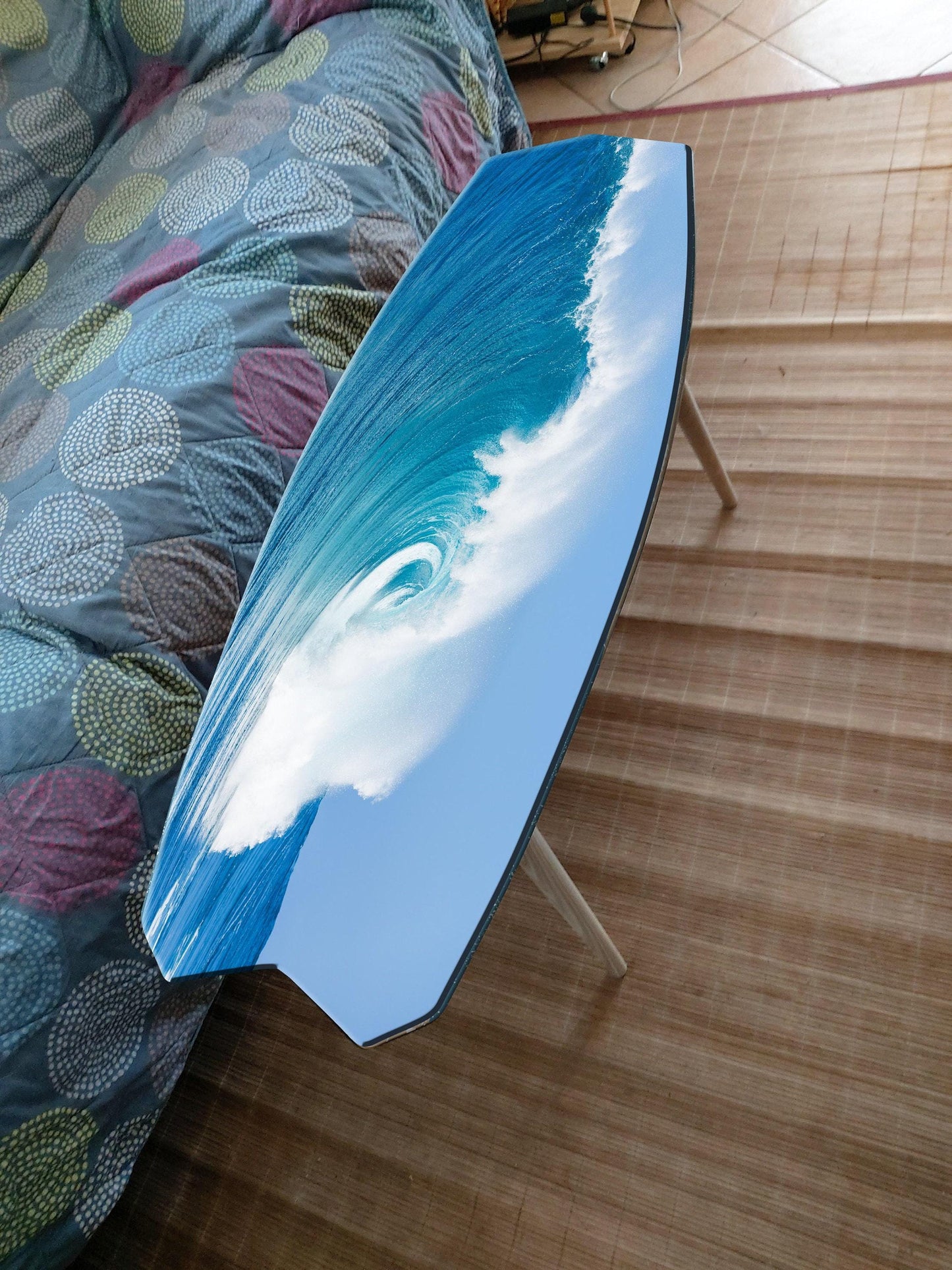 Surfboard coffee table with ocean wave