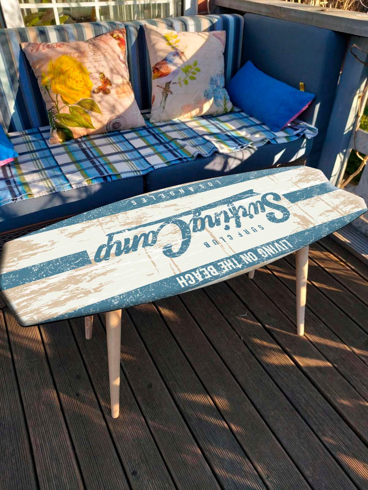 Surfboard coffee table with ocean wave