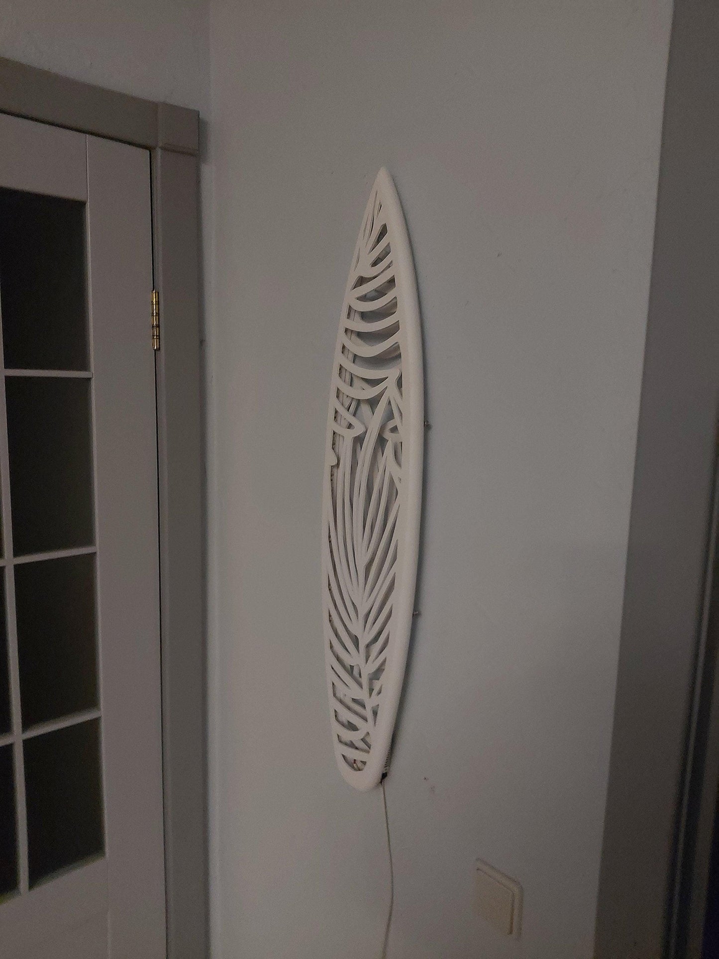 Surfboard inspired wall led light with botanical pattern