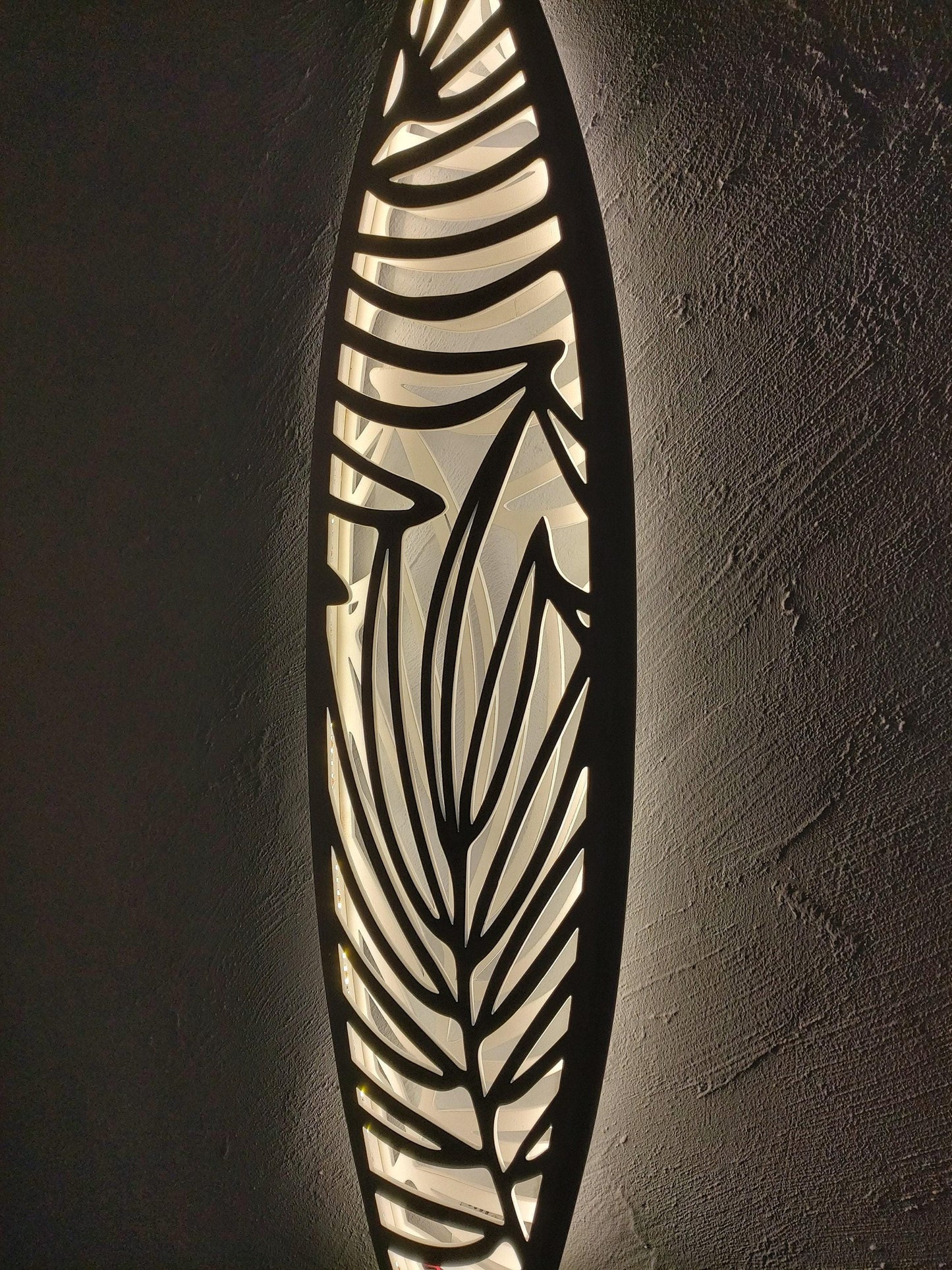 Surfboard inspired wall led light with botanical pattern