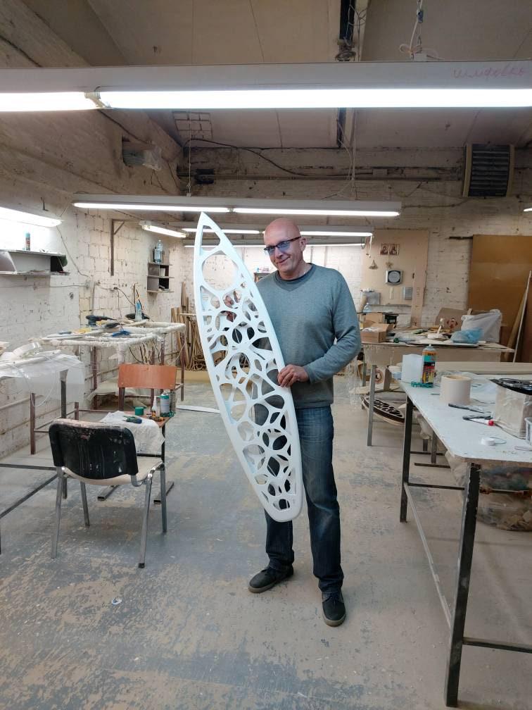 Surfboard shaped wooden decorative chandelier with carved sea ripple effect