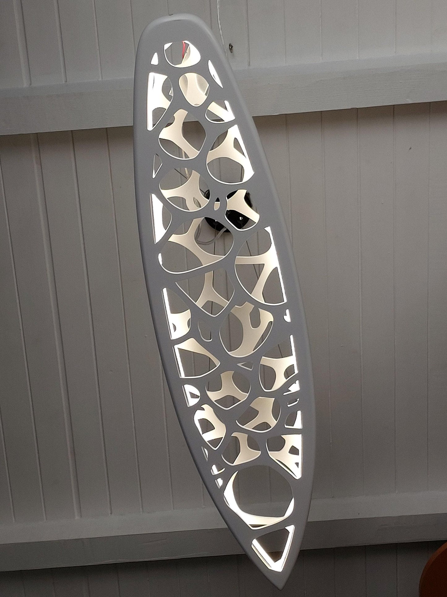 Surfboard shaped wooden decorative chandelier with carved sea ripple effect